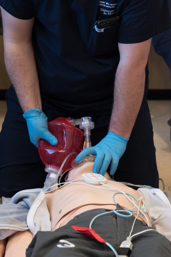 Medical Professional Practicing Bag Valve Mask Technique with Resusci Anne during FREC3 and FREC4 Training