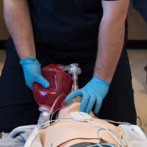Medical Professional Practicing Bag Valve Mask Technique with Resusci Anne during FREC3 and FREC4 Training